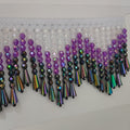 Handgemaakte kralenfranje van 1 meter lang en 9 cm breed met een ombré-effect in paars, geschikt als lampenkapfranje of voor het maken van een gordijn of kostuum.