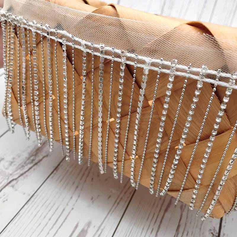 Glitterende strassfranje: koperkleurige kralenketting (90 cm lang)