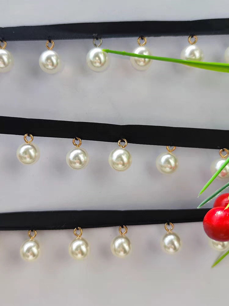 Glanzende, 90 cm lange, 12 mm parelkralen kanten franje