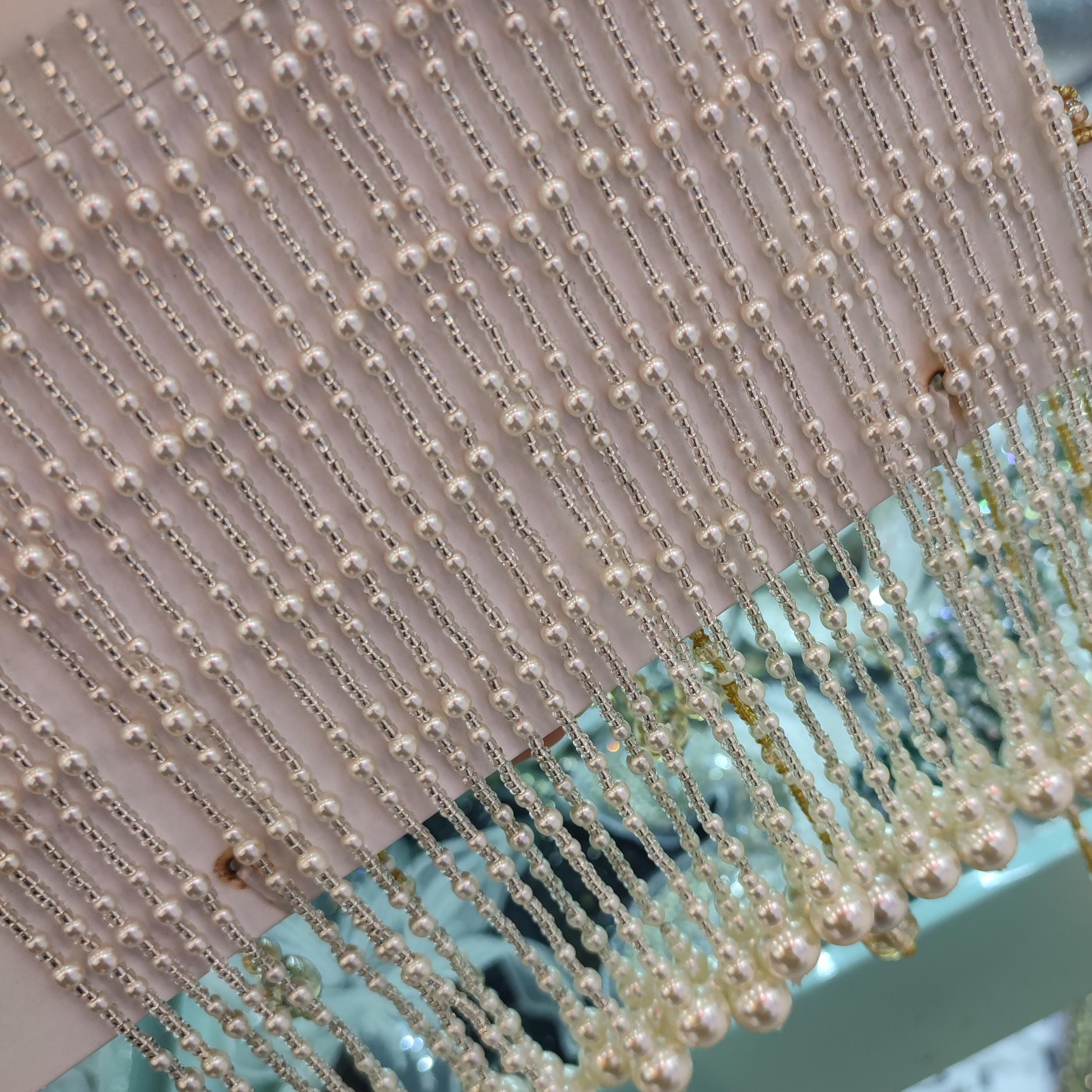 Handgemaakte 15 cm lange franje van parelmoer kralen: haute couture kostuumversiering